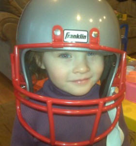 Maddie wearing Patriots helmet